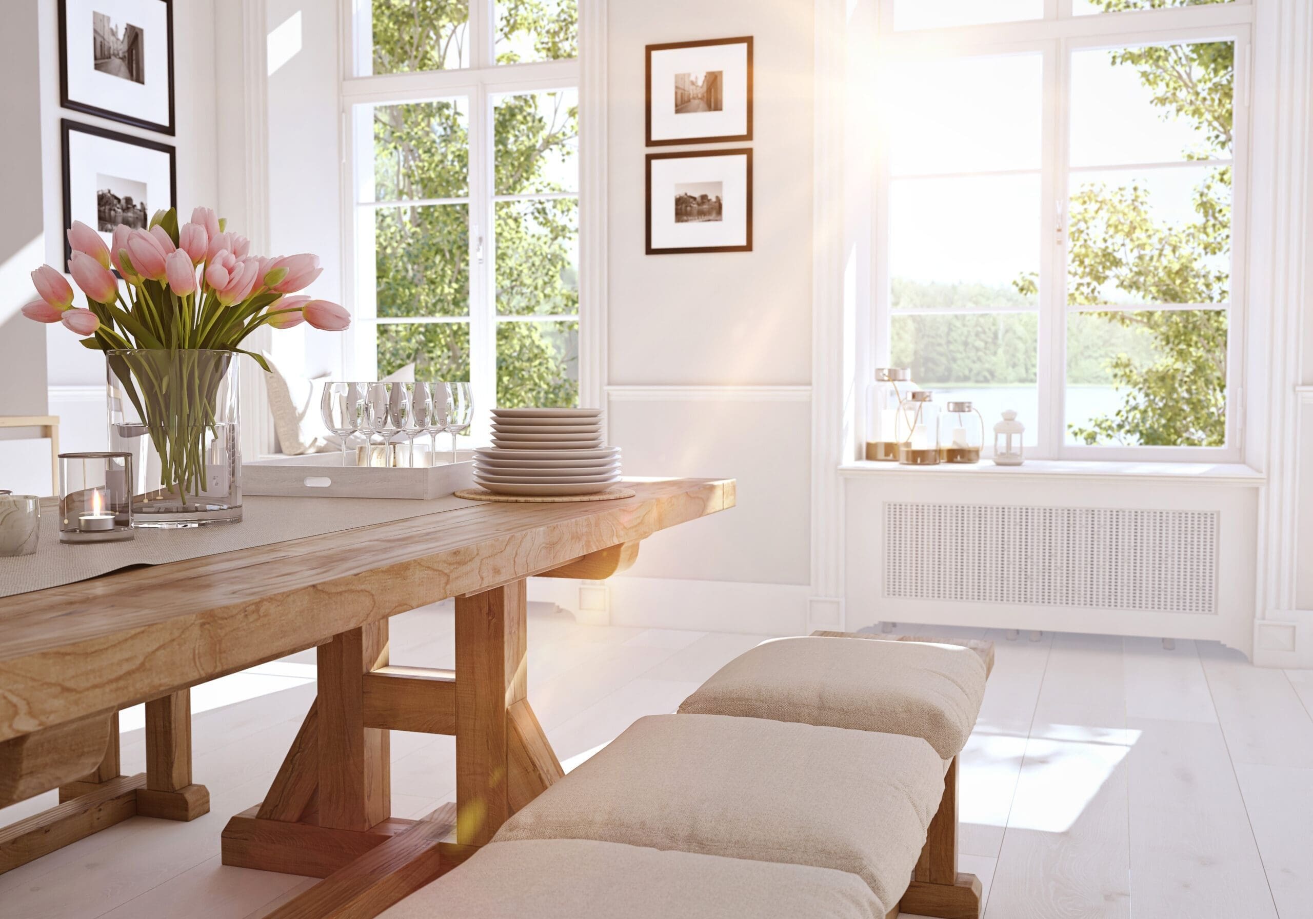 Bright dining room in Flowery Branch, Georgia, with large windows, wooden table, pink tulips, and sunlight streaming in.